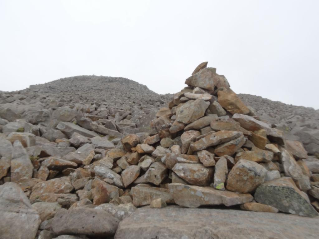 Cairn showing the way across the summit desert