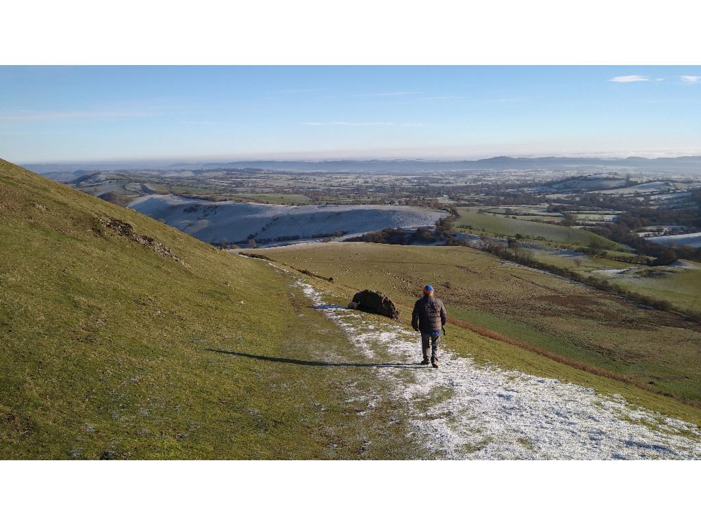 Path traversing down the east face of Caer Caradoc