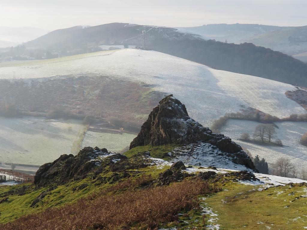 Gaer Stone on the south ridge of Hope Bowdler Hill, in the background Ragleth Hill