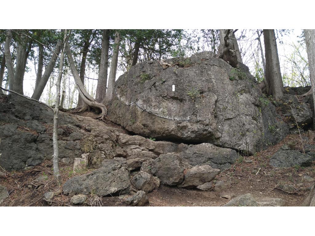 A chain helps me over the slippery rocks.