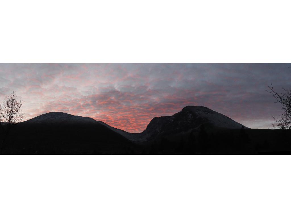 The sun is rising behind Ben Nevis...