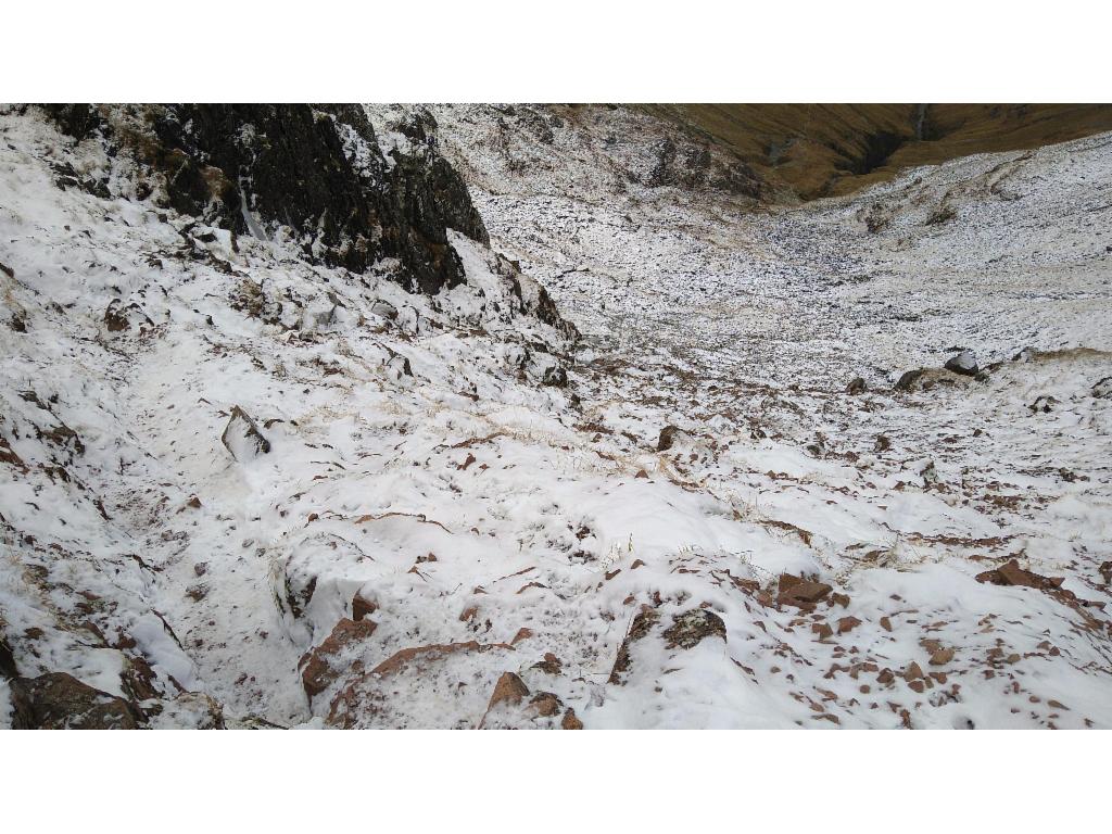 Looking down the steep ice and snow covered slope into Coire Gabhail